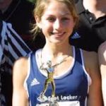 Athlete prepares for pole vault on a track with others watching.