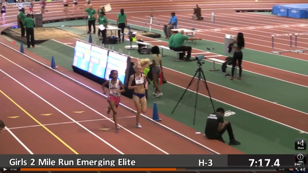Athlete prepares for pole vault on a track with others watching.