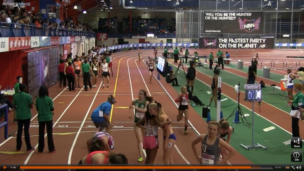 Athlete prepares for pole vault on a track with others watching.