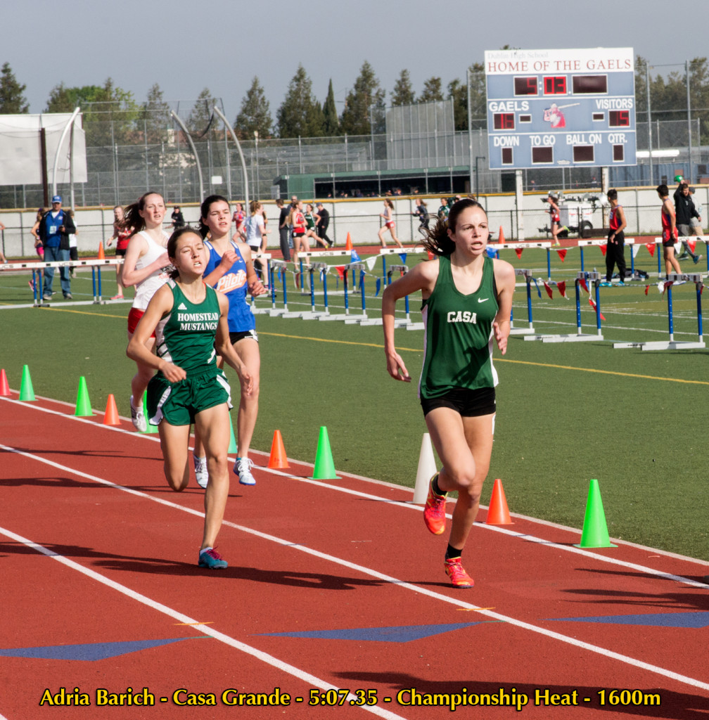 Athlete prepares for pole vault on a track with others watching.