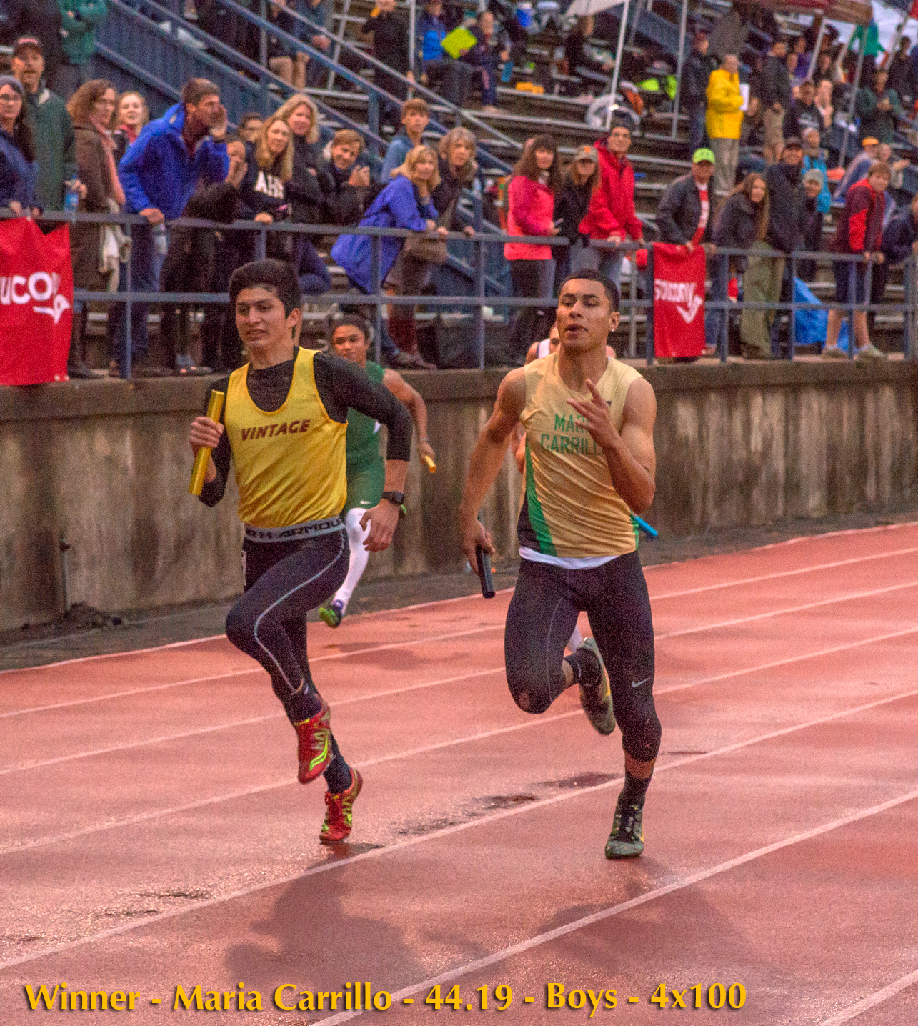 Athlete prepares for pole vault on a track with others watching.