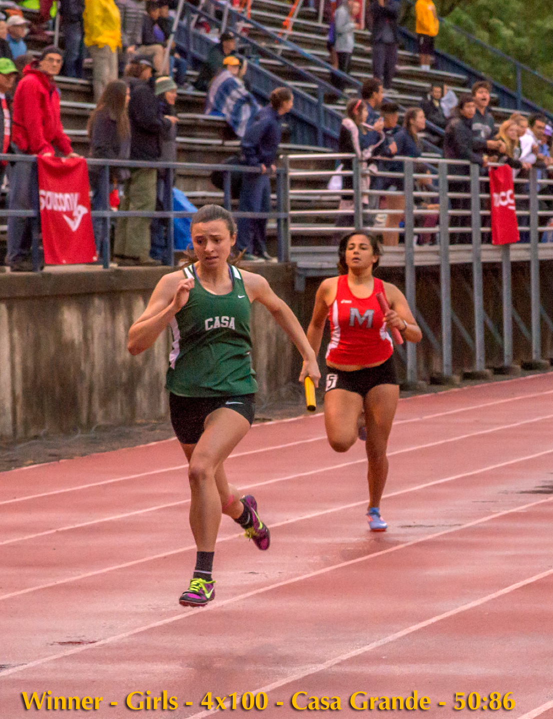 Athlete prepares for pole vault on a track with others watching.