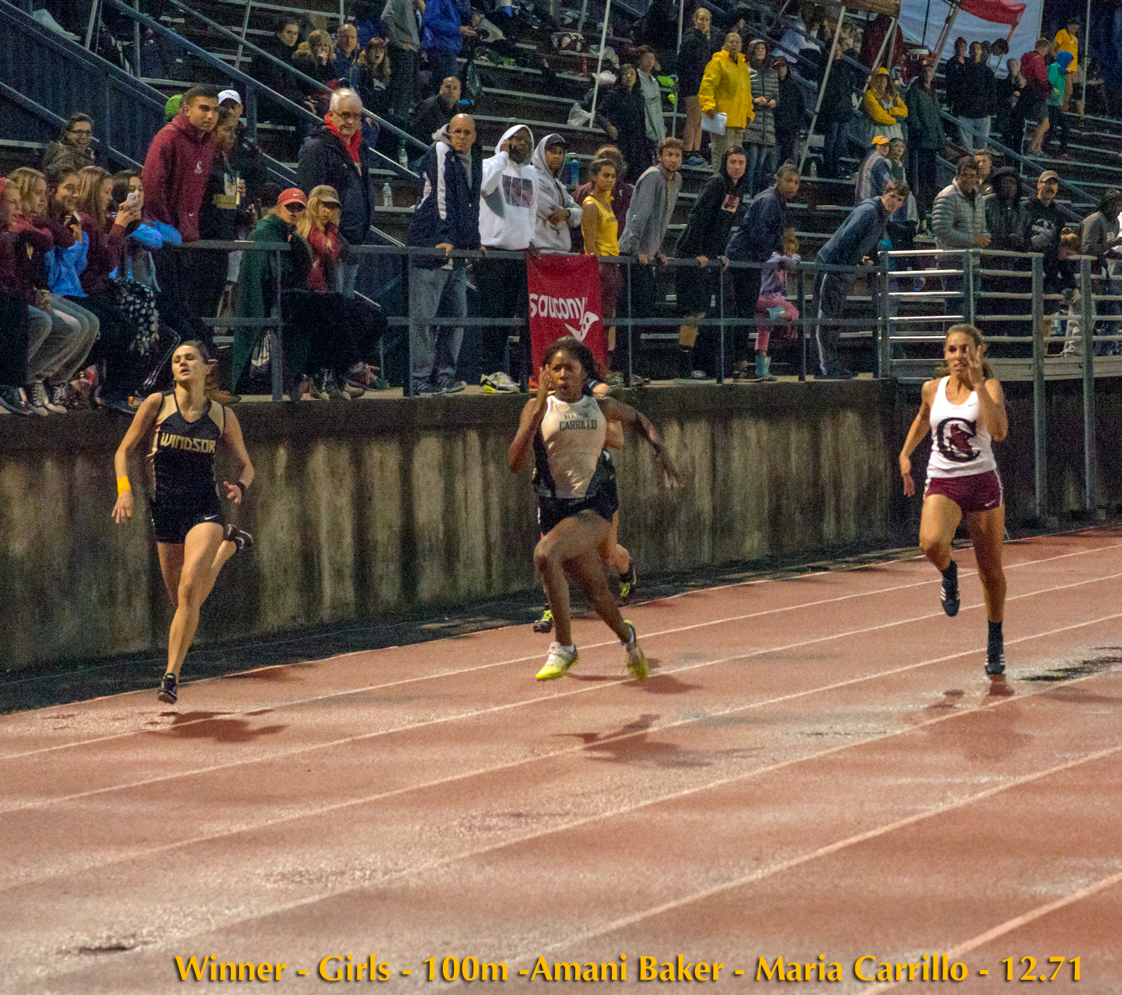 Athlete prepares for pole vault on a track with others watching.