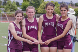 Athlete prepares for pole vault on a track with others watching.