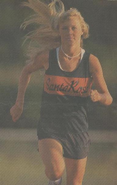 Athlete prepares for pole vault on a track with others watching.