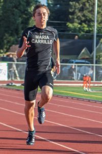 Athlete sprinting on a track during a race.