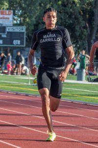 Athlete sprinting on a track during a race.