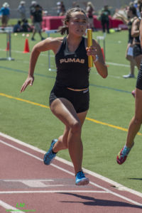 Athlete sprinting on a track during a race.