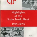 Athlete prepares for pole vault on a track with others watching.