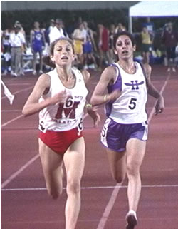 Athlete prepares for pole vault on a track with others watching.