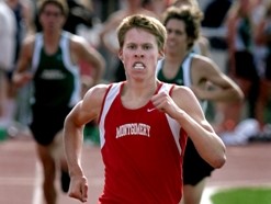 Athlete prepares for pole vault on a track with others watching.