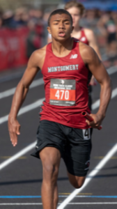 Athlete prepares for pole vault on a track with others watching.