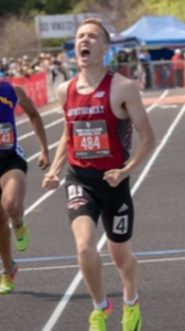 Athlete prepares for pole vault on a track with others watching.